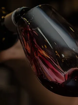Red wine being poured into a glass
