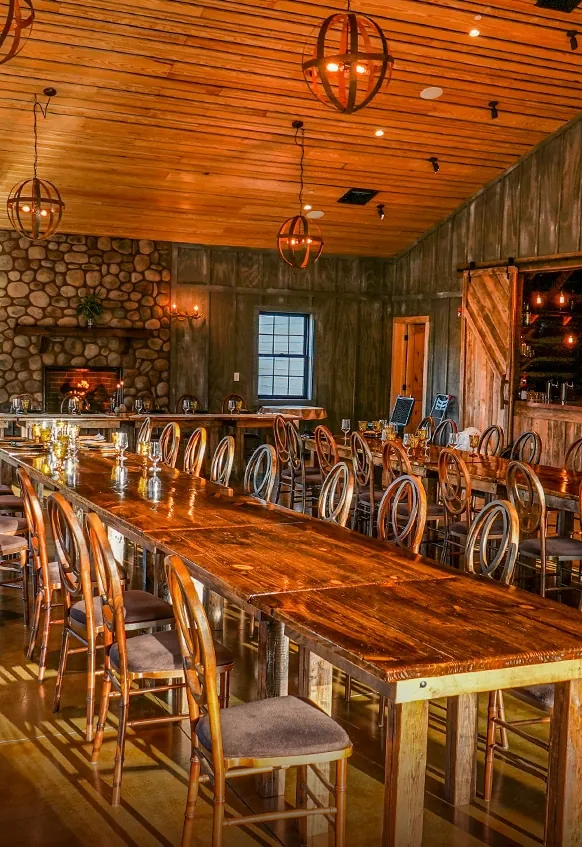 Long communal table set in the event center