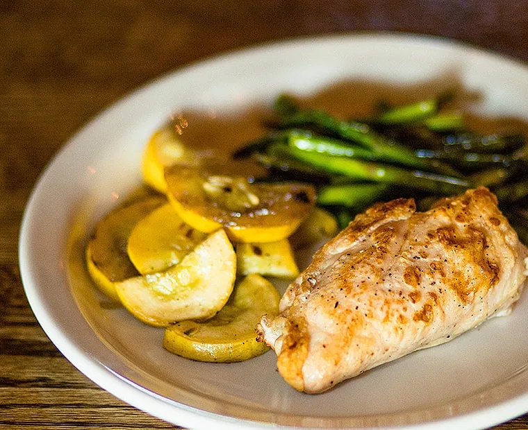 Chef-prepared paleo plate of chicken, squash and asparagus