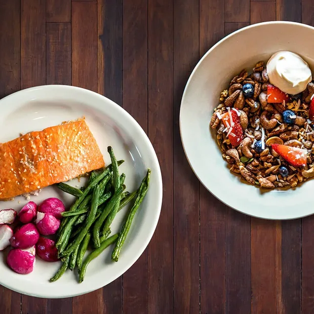 Salmon with green beans and radish on a paleo meal plate